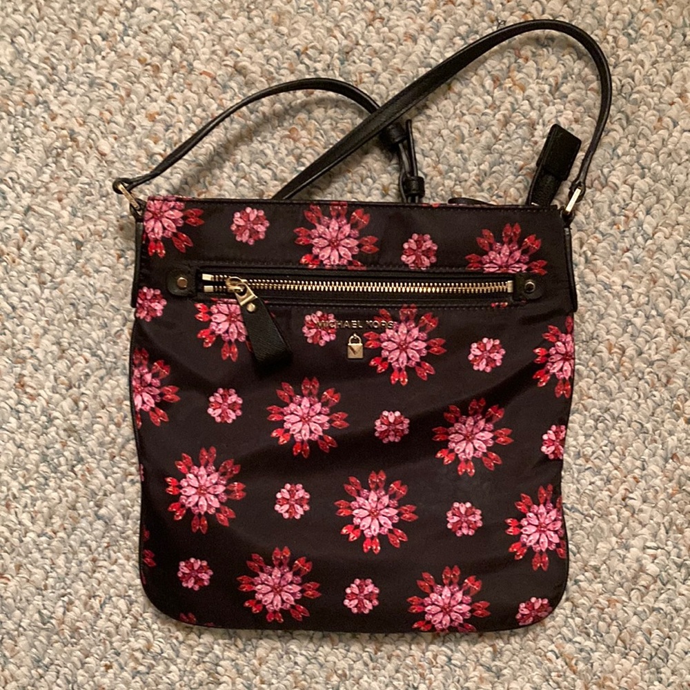 Micheal Kors Black w/ flower print. Cloth purse w/leather strap a summer classic